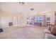 Bright living room featuring neutral walls, carpet, and built-in shelves at 352 W Graham Park Dr, Haines City, FL 33844