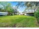 Wide open backyard includes a gazebo with red patio furniture and a storage shed at 3614 Twisted Oak Ct, Lake Wales, FL 33898