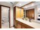 Bathroom boasts a dual sink vanity, large mirror, spacious closet, and a separate shower at 3614 Twisted Oak Ct, Lake Wales, FL 33898