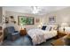 Serene bedroom with soft lighting and a large window with views of palm trees at 3614 Twisted Oak Ct, Lake Wales, FL 33898