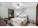 Bright bedroom featuring a ceiling fan, natural light, and comfortable furnishings at 3614 Twisted Oak Ct, Lake Wales, FL 33898
