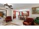 Elegant dining room with a chandelier, red walls, and a formal dining set for sophisticated meals at 3614 Twisted Oak Ct, Lake Wales, FL 33898