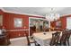 The dining room is spacious and elegant, with a large chandelier and ample seating for guests at 3614 Twisted Oak Ct, Lake Wales, FL 33898
