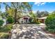 Charming exterior featuring a well-maintained building with shade trees and a spacious driveway at 3614 Twisted Oak Ct, Lake Wales, FL 33898