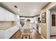 Eat-in kitchen features granite counters, breakfast bar, stainless steel appliances and wood floors at 3614 Twisted Oak Ct, Lake Wales, FL 33898