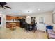 Functional kitchenette with wooden cabinets, modern appliances, and a dining area, perfect for casual meals at 3614 Twisted Oak Ct, Lake Wales, FL 33898