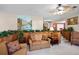 The living room is open and inviting, with decorative plants and comfortable seating at 3614 Twisted Oak Ct, Lake Wales, FL 33898