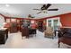 Spacious office featuring carpeted floors, a large desk, and custom shelving, plus a window for natural light at 3614 Twisted Oak Ct, Lake Wales, FL 33898