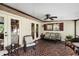 Covered patio featuring brick floors, comfortable seating, and plenty of natural light at 3614 Twisted Oak Ct, Lake Wales, FL 33898