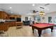 Spacious recreation room with a pool table, kitchenette, and ample seating for entertaining at 3614 Twisted Oak Ct, Lake Wales, FL 33898