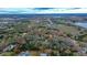 Aerial view of the home and property with a red boundary line, showing the generous treed lot and surrounding area at 3655 N Scenic Hwy, Lake Wales, FL 33898