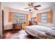Comfortable bedroom featuring hardwood floors, natural light, and a ceiling fan at 3655 N Scenic Hwy, Lake Wales, FL 33898