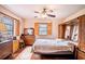 Bedroom featuring a ceiling fan, two large windows, and ample closet space at 3655 N Scenic Hwy, Lake Wales, FL 33898