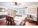 Formal dining room with large table, ceiling fan, and view to kitchen at 3655 N Scenic Hwy, Lake Wales, FL 33898
