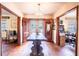 Dining room showcases an antique table with hardwood floors and natural light from the door at 3655 N Scenic Hwy, Lake Wales, FL 33898