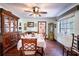 Formal dining room featuring a large table, ceiling fan, and built-in china cabinet at 3655 N Scenic Hwy, Lake Wales, FL 33898