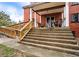 View of the steps and wheelchair ramp leading to the second-story porch of the house at 3655 N Scenic Hwy, Lake Wales, FL 33898