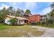 Spacious property showcasing a brick house with multiple decks and outdoor seating areas, perfect for outdoor living at 3655 N Scenic Hwy, Lake Wales, FL 33898