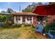 Charming home with a tidy yard, red brick accents, and outdoor seating, creating an inviting curb appeal at 3655 N Scenic Hwy, Lake Wales, FL 33898
