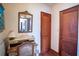 Hallway featuring a classic desk, mirror, and traditional wood trim at 3655 N Scenic Hwy, Lake Wales, FL 33898