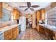 Spacious kitchen with a view into the dining room, wooden cabinets, and tile flooring at 3655 N Scenic Hwy, Lake Wales, FL 33898