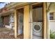 Enclosed exterior laundry room with washer and dryer, maximizing space and convenience for laundry tasks at 3655 N Scenic Hwy, Lake Wales, FL 33898