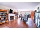 Bright living room featuring wood floors, a fireplace with built-in bookshelves, and natural light at 3655 N Scenic Hwy, Lake Wales, FL 33898