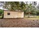 Utility barn with beige siding and an adjacent canopy, providing outdoor storage at 3655 N Scenic Hwy, Lake Wales, FL 33898
