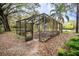 Open pool metal structure with foliage around the pool needing repair at 3655 N Scenic Hwy, Lake Wales, FL 33898