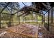 Empty in-ground pool with metal structure needing repair and filled with leaves at 3655 N Scenic Hwy, Lake Wales, FL 33898