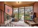 Enclosed sunroom provides views of the landscaped yard and access to the outdoors at 3655 N Scenic Hwy, Lake Wales, FL 33898