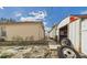 A view of the backyard between the house and a shed at 3690 Wellington Pl, Bartow, FL 33830