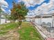 Spacious backyard featuring a mature tree, patio area, and storage shed at 3690 Wellington Pl, Bartow, FL 33830
