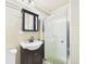Bright bathroom with a sink, toilet, mirrored cabinet and shower stall at 3690 Wellington Pl, Bartow, FL 33830