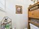 Bathroom featuring toilet, cabinetry, and framed prints on the wall at 3690 Wellington Pl, Bartow, FL 33830