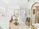 Spacious bathroom with walk-in shower, tiled floor, vanity, and additional doorway at 3690 Wellington Pl, Bartow, FL 33830
