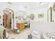Bathroom featuring vanity, soaking tub, decorative mirrors, and tiled floor at 3690 Wellington Pl, Bartow, FL 33830