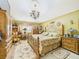 Comfortable bedroom featuring a chandelier, ceiling medallion and decorative rug at 3690 Wellington Pl, Bartow, FL 33830