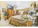 Comfortable bedroom featuring a chandelier, ceiling medallion and decorative rug at 3690 Wellington Pl, Bartow, FL 33830