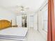 Light-filled bedroom with a ceiling fan, closet, and view of adjacent rooms at 3690 Wellington Pl, Bartow, FL 33830