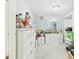 Cozy bedroom featuring white dressers, pale blue walls, carpeted floors and walk-in closet for ample storage at 3690 Wellington Pl, Bartow, FL 33830