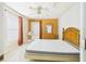 Bedroom with wood furniture, including a wooden-frame bed, dresser, and an exterior door at 3690 Wellington Pl, Bartow, FL 33830