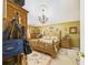 Comfortable bedroom featuring a chandelier, ceiling medallion and decorative rug at 3690 Wellington Pl, Bartow, FL 33830