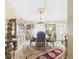 Elegant dining room boasting a large cabinet, chandelier, and traditional dining set at 3690 Wellington Pl, Bartow, FL 33830