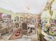 Charming dining area with a display cabinet, elegant dining set, and natural lighting at 3690 Wellington Pl, Bartow, FL 33830