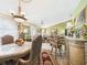 Open-concept space blending the dining room with a bar and a view into the living room at 3690 Wellington Pl, Bartow, FL 33830