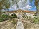 Charming single story home featuring a well-maintained lawn, mature trees, and a light-colored facade at 3690 Wellington Pl, Bartow, FL 33830
