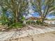 A charming one-story home with well-maintained landscaping and mature trees at 3690 Wellington Pl, Bartow, FL 33830