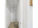 Hallway with carpeted floor and white walls providing access to different parts of the home at 3690 Wellington Pl, Bartow, FL 33830