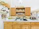 Functional kitchen showcasing a stainless steel sink, plenty of cabinetry and granite countertop space at 3690 Wellington Pl, Bartow, FL 33830
